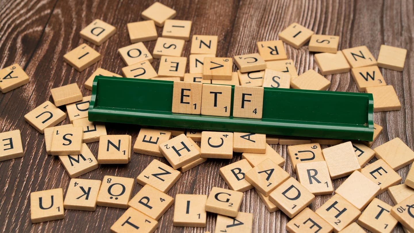 Exchange-traded fund share certificates and market data on a trading screen
